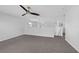 An open and inviting loft space with neutral tones and a ceiling fan at 11130 Summer Star Dr, Riverview, FL 33579