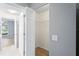 Open closet features white shelving and bi-fold doors to the bedroom at 11412 Alden Ct, Hudson, FL 34667