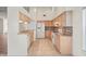 Spacious kitchen with tile floors, granite countertops, and stainless steel appliances at 11412 Alden Ct, Hudson, FL 34667