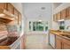 Charming eat-in kitchen with light wood cabinetry, granite countertops, and a bay window nook at 11412 Alden Ct, Hudson, FL 34667