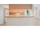 Kitchen with granite countertops, breakfast bar, and modern stainless steel appliances at 11412 Alden Ct, Hudson, FL 34667