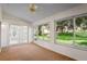 Bright sunroom with windows overlooking the backyard at 11412 Alden Ct, Hudson, FL 34667