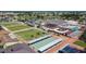 Aerial view of lawn bowling, shuffleboard and community pool and clubhouse at 1207 Chevy Chase Dr, Sun City Center, FL 33573