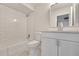 Well-lit bathroom features subway tile surround in shower and tub, with modern vanity at 1207 Chevy Chase Dr, Sun City Center, FL 33573
