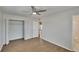 Bedroom with Hardwood floors, ceiling fan, closet, and ensuite bathroom at 1207 Chevy Chase Dr, Sun City Center, FL 33573