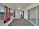 Cozy sunroom with carpeted floors, blinds, and ceiling fan at 1207 Chevy Chase Dr, Sun City Center, FL 33573