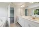 Modern bathroom with double vanity, large mirror, and stylish fixtures at 12758 Oak Hill Way, Parrish, FL 34219