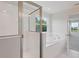 Bright bathroom featuring a separate shower and soaking tub at 12758 Oak Hill Way, Parrish, FL 34219
