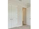 Bedroom with double closets, neutral carpet, and fresh paint at 12758 Oak Hill Way, Parrish, FL 34219