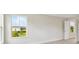 Bright bedroom featuring a window with a view and neutral color palette at 12758 Oak Hill Way, Parrish, FL 34219
