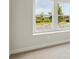 Bedroom with neutral carpet, fresh paint, and windows overlooking the yard at 12758 Oak Hill Way, Parrish, FL 34219