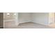 Carpeted bedroom leading to a bathroom and large closet at 12758 Oak Hill Way, Parrish, FL 34219