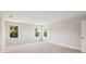 Spacious bedroom with three large windows offering plenty of natural light at 12758 Oak Hill Way, Parrish, FL 34219
