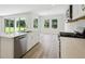 Modern kitchen with stainless steel appliances, large island and plenty of natural light at 12758 Oak Hill Way, Parrish, FL 34219