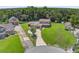 Expansive property featuring a well-maintained lawn and mature trees surrounding the home at 1357 Dinsmore Ct, New Port Richey, FL 34655