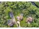 Overview of residential properties surrounded by lush, mature trees at 1357 Dinsmore Ct, New Port Richey, FL 34655