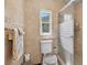 Tiled bathroom with glass enclosed shower and window for natural light at 1357 Dinsmore Ct, New Port Richey, FL 34655