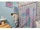 Bathroom features a mermaid themed shower curtain at 1357 Dinsmore Ct, New Port Richey, FL 34655