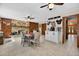 Open dining area features tile floors, a brick fireplace, and custom coffee bar for entertaining at 1357 Dinsmore Ct, New Port Richey, FL 34655