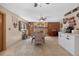 Dining room featuring tile floors, dining table, and a brick fireplace at 1357 Dinsmore Ct, New Port Richey, FL 34655