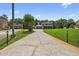 Two story home features a textured driveway, attached garage, and well-manicured lawn at 1357 Dinsmore Ct, New Port Richey, FL 34655