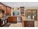 Inviting kitchen with granite countertops, stainless steel appliances, and direct access to the pool at 1357 Dinsmore Ct, New Port Richey, FL 34655