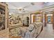 Cozy living room with plush seating, unique decor, and seamless access to the foyer area at 1357 Dinsmore Ct, New Port Richey, FL 34655