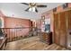 Open loft area with hardwood floors and a view of the living space below at 1357 Dinsmore Ct, New Port Richey, FL 34655