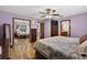 Spacious main bedroom with hardwood floors, double bed, and closet with mirror doors at 1357 Dinsmore Ct, New Port Richey, FL 34655
