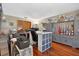 Craft room with hardwood flooring, cabinets, storage, and functional workspace with bright lighting at 1357 Dinsmore Ct, New Port Richey, FL 34655