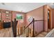 Stairwell featuring wood floors and wooden railings at 1357 Dinsmore Ct, New Port Richey, FL 34655