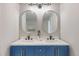 Bathroom with double sink vanity and oval mirrors at 140 88Th Ne Ave, St Petersburg, FL 33702