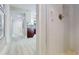 Bright bathroom featuring white subway tile, a shower with grab bar and white cabinets in the background at 140 88Th Ne Ave, St Petersburg, FL 33702