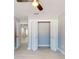 Bedroom featuring closet, entrance, and modern ceiling fan and lighting at 140 88Th Ne Ave, St Petersburg, FL 33702