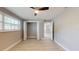 Bright bedroom with hardwood floors, ceiling fan, and ample closet space at 140 88Th Ne Ave, St Petersburg, FL 33702