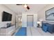 Bedroom featuring closet, entrance, media dresser, modern ceiling fan and lighting at 140 88Th Ne Ave, St Petersburg, FL 33702