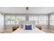 Sun-filled bedroom with shuttered windows and stylish decor at 140 88Th Ne Ave, St Petersburg, FL 33702