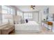 Bright bedroom with shuttered windows, art, and stylish décor at 140 88Th Ne Ave, St Petersburg, FL 33702