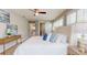 Bedroom with shuttered windows, stylish décor and sliding door leading to bathroom at 140 88Th Ne Ave, St Petersburg, FL 33702