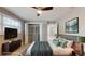 Bedroom design features a bed, wall art, TV, and spacious closet at 140 88Th Ne Ave, St Petersburg, FL 33702