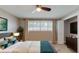 Bedroom features a comfortable bed, ample natural light, curtains, and modern decor at 140 88Th Ne Ave, St Petersburg, FL 33702
