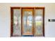Close-up of the home's decorative glass front door at 140 88Th Ne Ave, St Petersburg, FL 33702