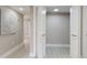Hallway features white doors and decorative wall art at 140 88Th Ne Ave, St Petersburg, FL 33702