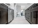 Modern kitchen featuring sleek dark cabinets, stainless steel appliances, and an open layout at 140 88Th Ne Ave, St Petersburg, FL 33702