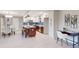 Spacious kitchen and dining area featuring an island, stainless steel appliances, and modern decor at 140 88Th Ne Ave, St Petersburg, FL 33702