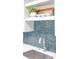 Close-up of a stylish kitchen backsplash with a stainless steel sink and modern faucet at 140 88Th Ne Ave, St Petersburg, FL 33702