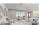 Living room with natural light showcasing neutral tones, comfortable seating, and an open floorplan at 140 88Th Ne Ave, St Petersburg, FL 33702