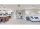 Open-concept living room featuring light hardwood floors and an open layout at 140 88Th Ne Ave, St Petersburg, FL 33702