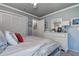 Bright bedroom featuring a plush bed, a ceiling fan and a chest of drawers at 140 Dale Pl, Oldsmar, FL 34677