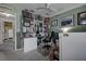 Bedroom featuring a built in desk with shelves, a ceiling fan and lots of natural light at 140 Dale Pl, Oldsmar, FL 34677